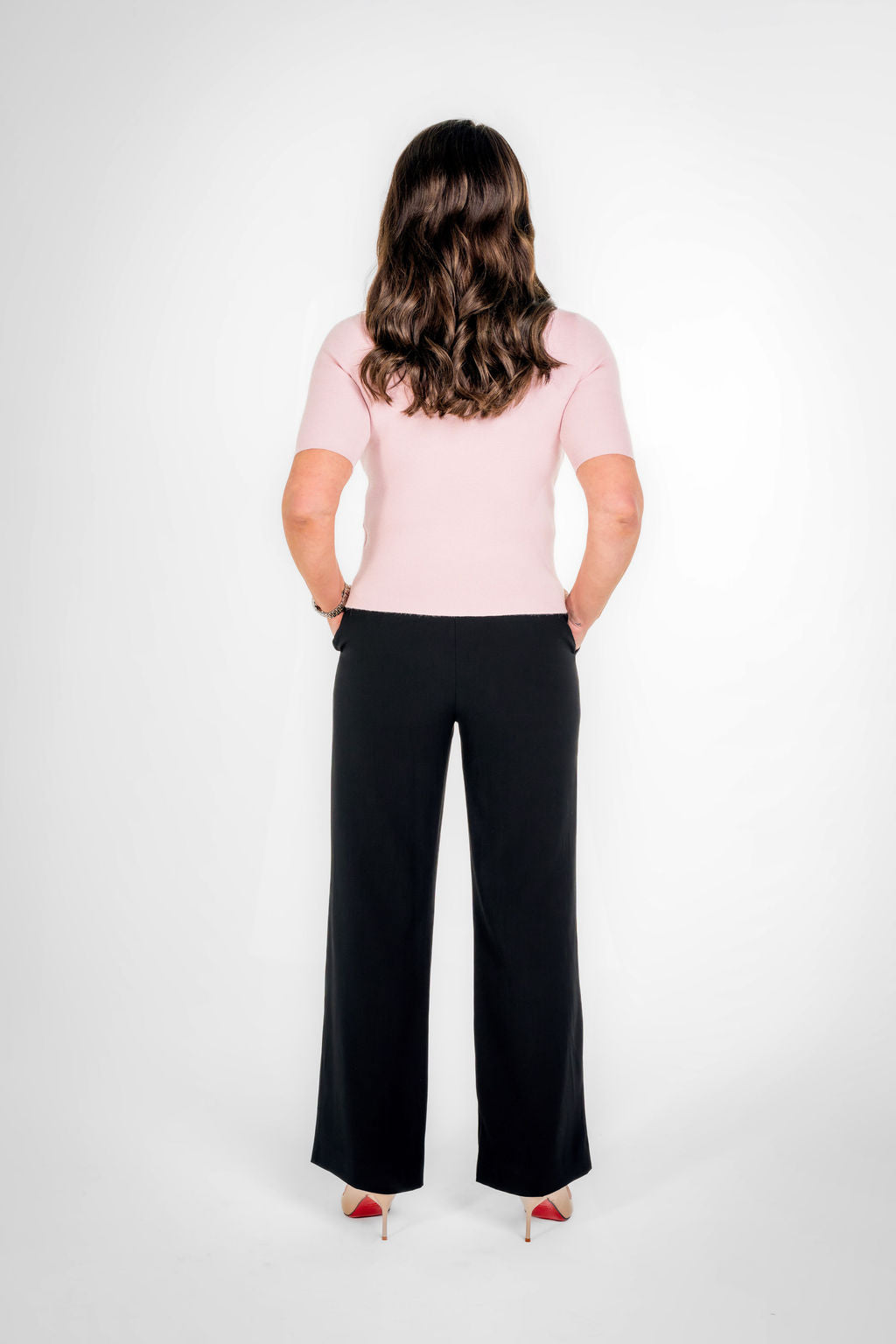 Woman wearing pink knitwear
