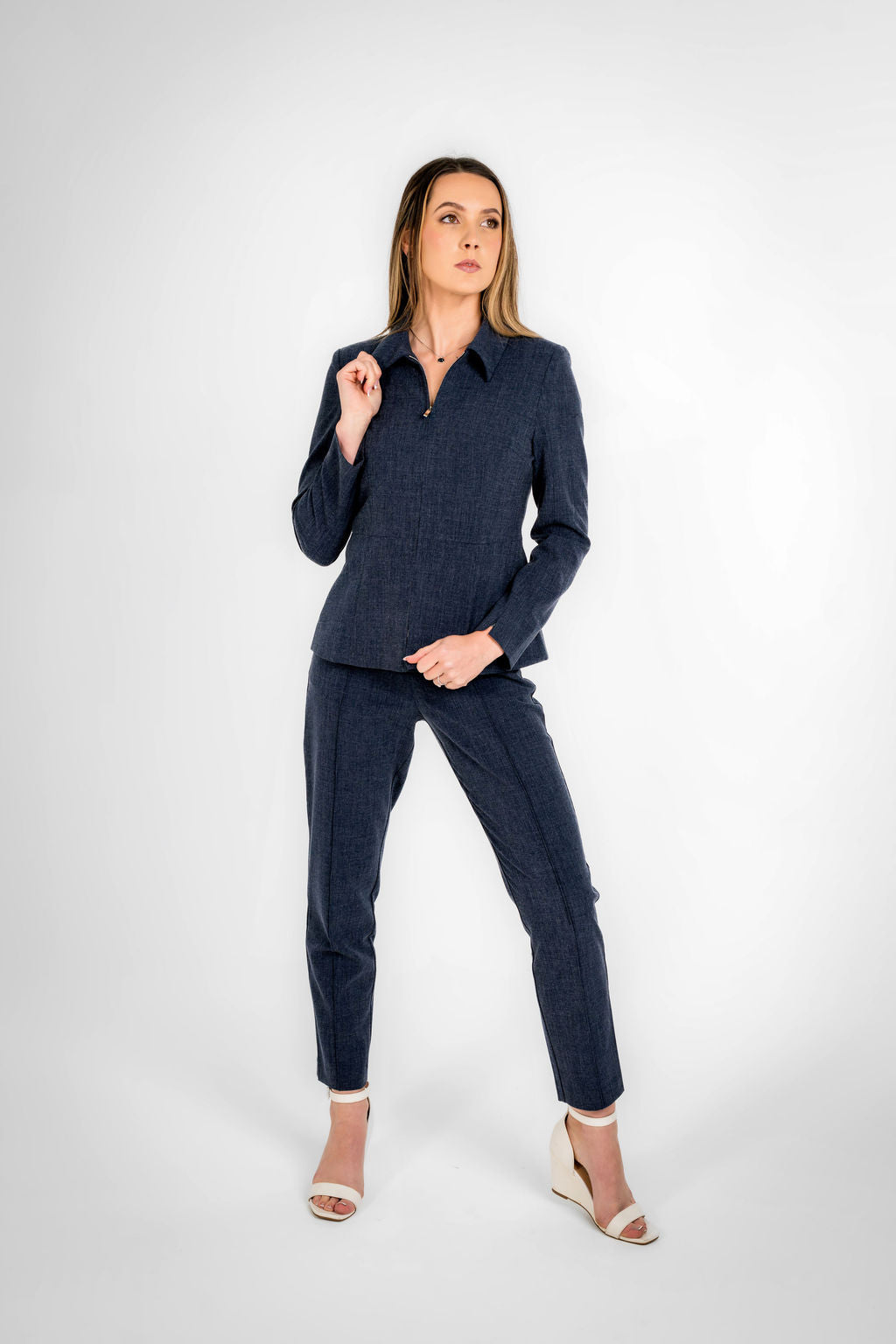 Woman wearing a navy blue straight pant 