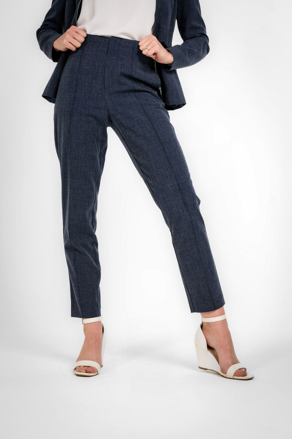 Woman wearing a navy blue straight pant 
